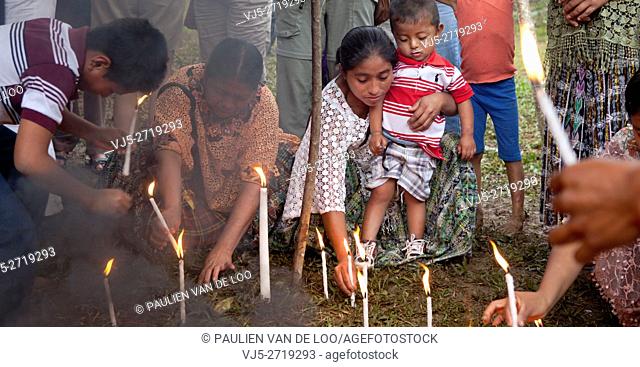 Chahal, Alta Verapaz, Guatemala, Maya tribe, burning candles are put into the ground for a good harvest and gratitude