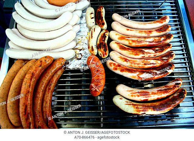 Variety of sausages on the barbecue grill . Switzerland