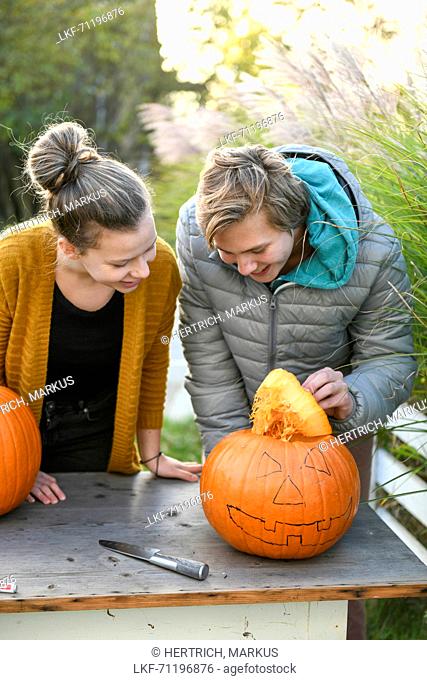 Children with pumpkin on Halloween, Hamburg, Germany