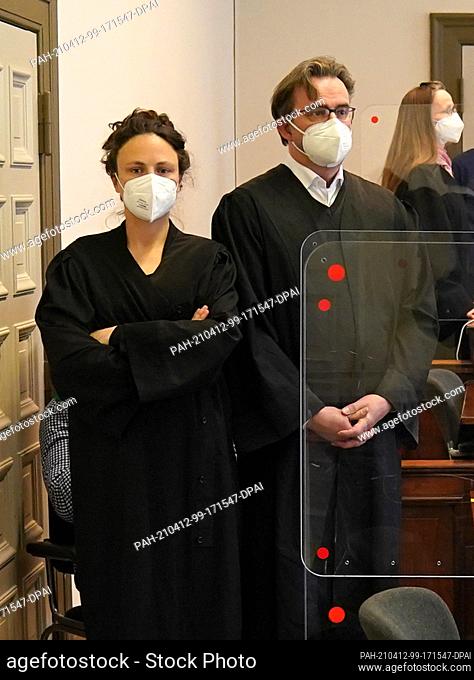 12 April 2021, Hamburg: The accused sits behind his defence lawyers Fenna Busmann (l) and Florian Melloh in the courtroom at the Criminal Justice Building at...