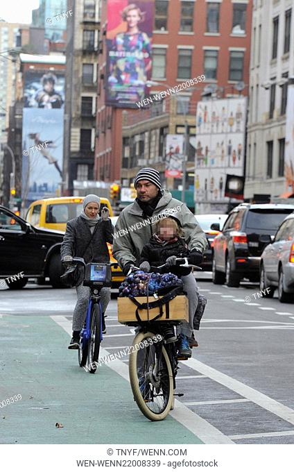Liev Schreiber takes his two sons, Samuel and Alexander, to school on his bicycle with Naomi Watts tailing on her citi-bike on a cold winter morning in...