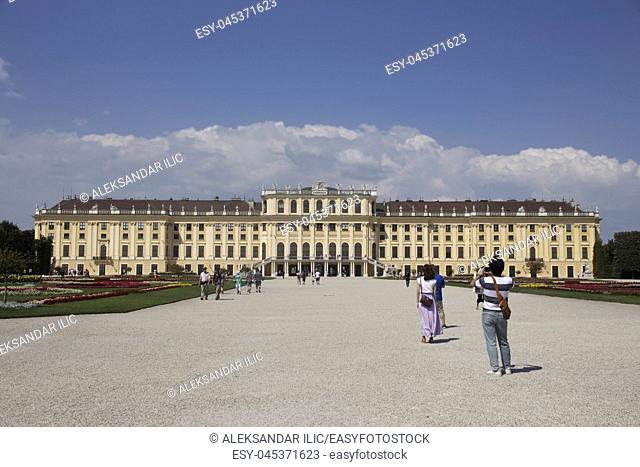 Vienna, Austria - July 06 2018: ""Schonbrunn"" palace (Schloss Schönbrunn) and the park with a blue sky and cloudsâ. “ Stock Editorial Photo