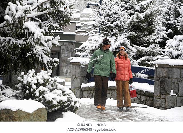 Young couple in Whistler Village, Whistler, British Columbia, Canada
