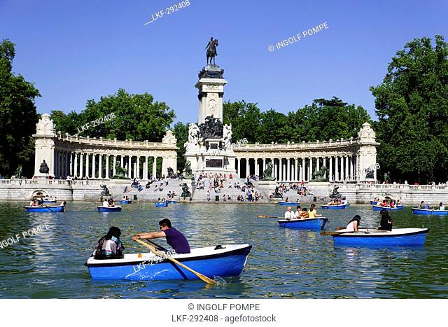 People relaxing near Monument to Alfonso XII, Parque del Buen Retiro, Madrid, Spain