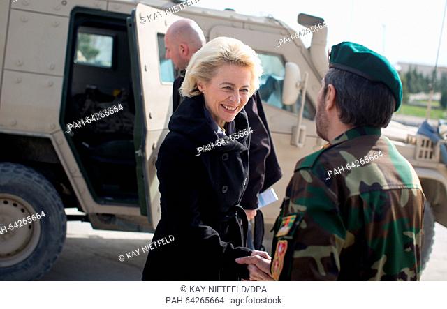German Minister of Defence Ursula von der Leyen is greeted by an Afghan commander at Camp Shaheen, a field camp for the Afghan Army, in Mazar-i-Sharif