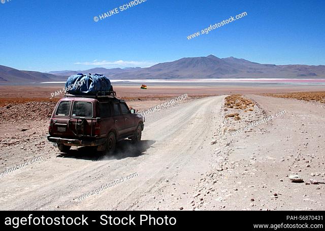 An off-road vehicle stands on October 15, 2009 on a runway in the Altiplano of the Andes on the way from San Pedro de Atacama (Chile) to Uyuni, Bolivia
