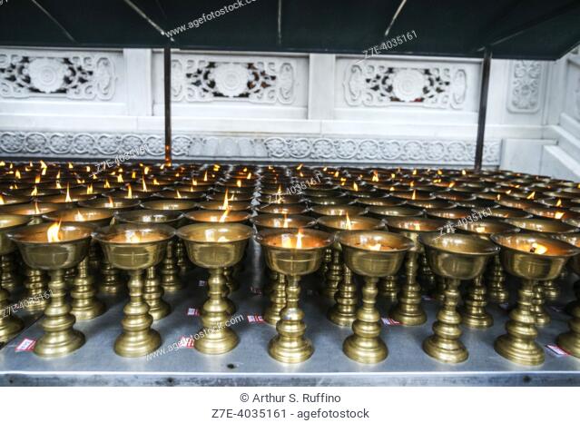 Votive candles. Lingyun Temple, Leshan City, Sichuan Province, People's Republic of China