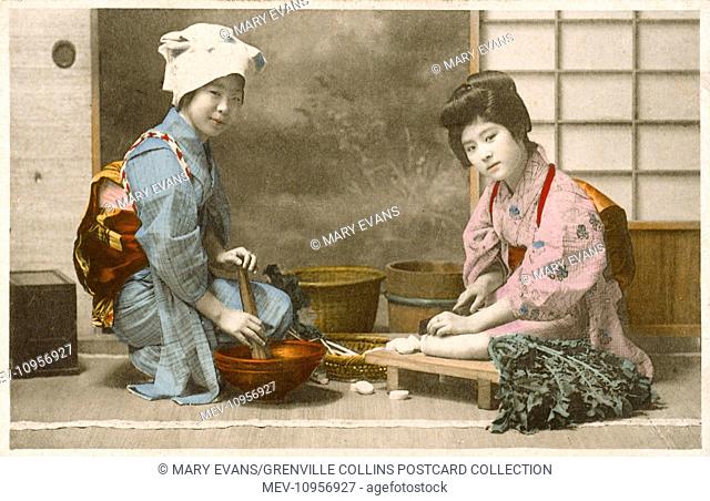Japan - Women preparing food including a Geisha girl preparing (cutting) daikon (white radish), possibly for takuan or bettarazuke dishes and another woman...