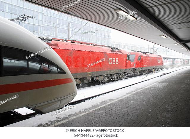 Railjet the Austro Federal Railroad train and german Ice at the main station in Munich