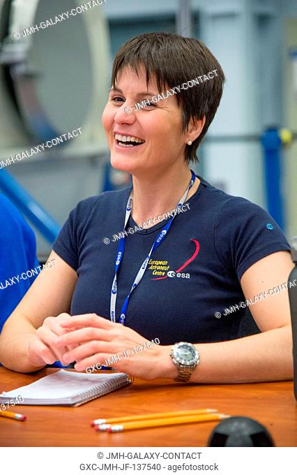 European Space Agency astronaut Samantha Cristoforetti, Expedition 4243 flight engineer, enjoys a light moment during an emergency scenario training session in...