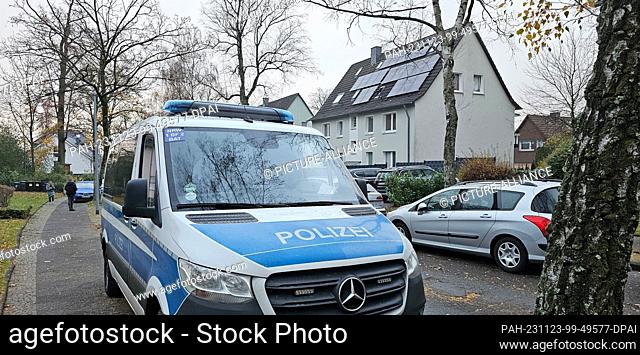 23 November 2023, North Rhine-Westphalia, Bochum: A police vehicle stands on the street during a raid in Bochum-Weitmar. Security forces have searched several...