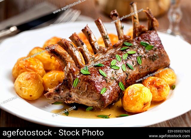 Grilled Rack of Lamb chops with potatoes on a plate