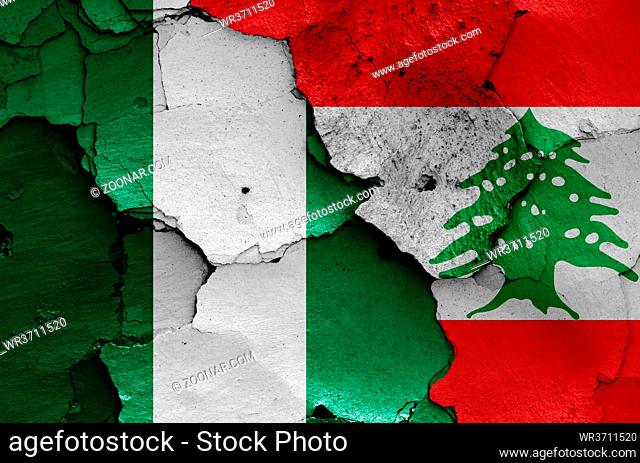 flags of Nigeria and Lebanon painted on cracked wall