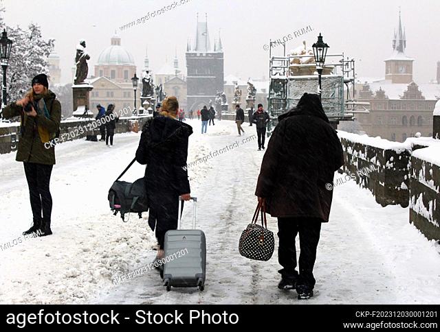 Tourists walking in the Charles Bridge in winter, Prague, Czech Republic, December 2, 2023. (CTK Photo/Milos Ruml)