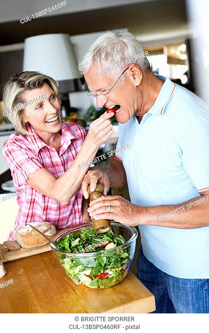 Senior Couple Preparing Salad