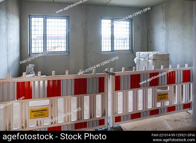 14 October 2022, Saxony, Zwickau: View into a room under construction of the new large prison for Saxony and Thuringia. Construction work in the Marienthal...