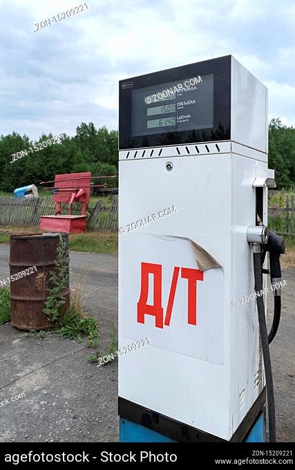 KAMCHATKA PENINSULA, RUSSIAN FAR EAST - 30 JULY, 2018: Old Soviet fuel dispenser with electronic scoreboard for diesel fuel at provincial gas station in...