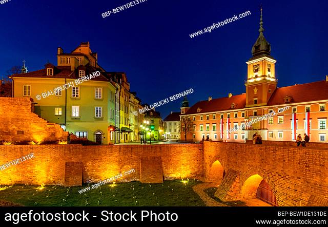 Warsaw, Poland - April 28, 2021: Evening panorama of Castle Square with Royal Castle and defense city walls in Starowka Old Town historic district