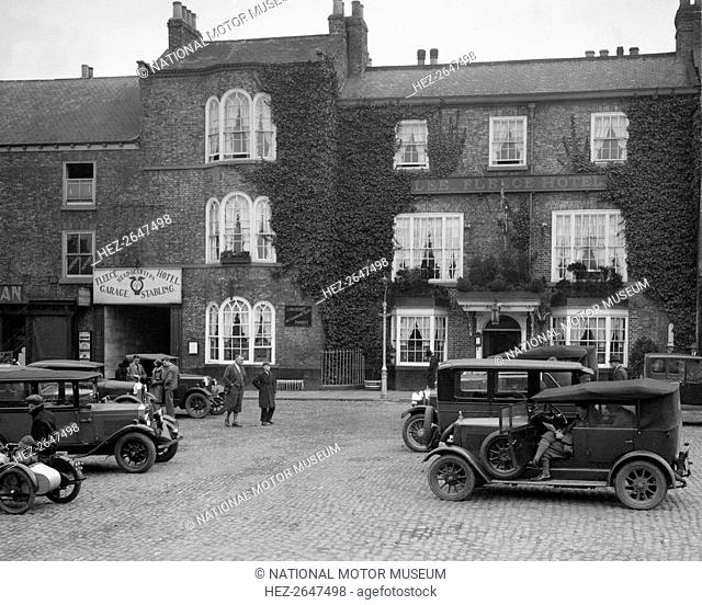 Cars parked outside the Fleece Hotel, Thirsk, Yorkshire, Ilkley & District Motor Club Trial, 1930s. Artist: Bill Brunell