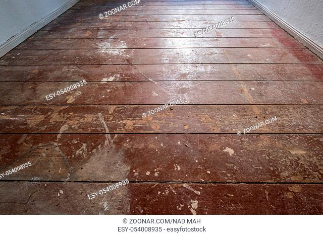 old wooden floor / floorboards in old apartment room - construction concept -