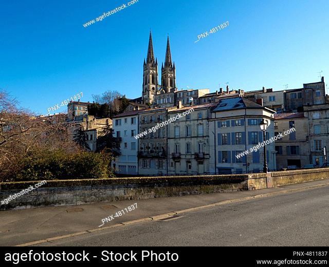 Cathedral emerging over city's house roofs, Niort, France