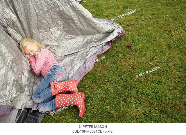 Girl sleeping on tent