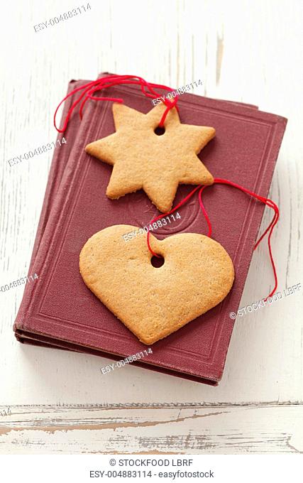 Gingerbread biscuits with ribbons on a book
