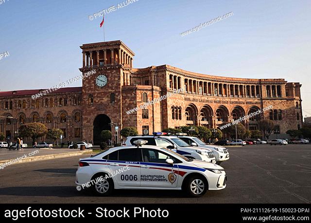 14 November 2021, Armenia, Jerewan: Police cars are parked in front of the building of the Government of the Republic of Armenia on Republic Square in downtown...
