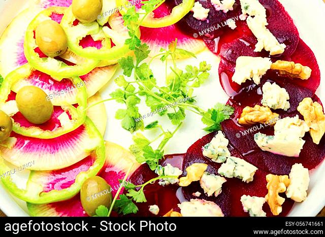 Vegetable salad with beets, bell pepper, cheese and nuts.Healthy vegetable salad