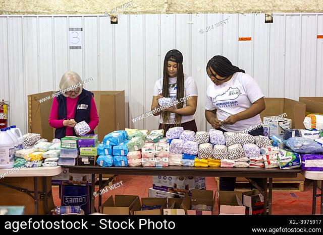 Mayfield, Kentucky - Volunteers sort donated food, clothing, and other supplies at the Tornado Relief Center at the Graves County Fairgrounds