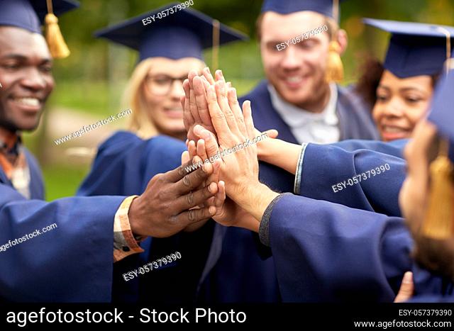 international graduate students making high five