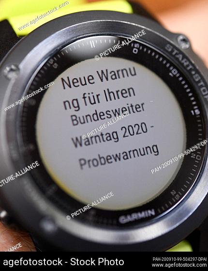 10 September 2020, Hessen, Wiesbaden: ILLUSTRATION - The display of a sports watch shows the information ""New warning for your nationwide warning day 2020 -...