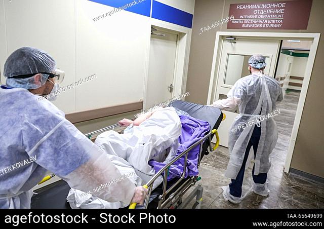 RUSSIA, ST PETERSBURG - DECEMBER 11, 2023: Medical workers move a COVID-19 ward patient at St George City Hospital. According to Irina Katayeva