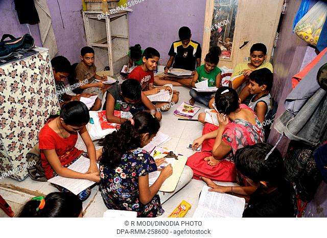 children Study in room Slum area, Dharavi, mumbai, maharashtra, India, Asia