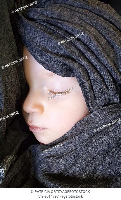 Wrapped baby sleeping