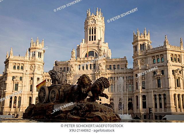 the fountain Fuente de Cibeles and the former post office Palacio de Comunicaciones or Palacio de Cibeles on Plaza de Cibeles, Madrid, Spain, Europe