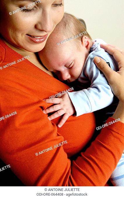 Mother holding a baby in her arms