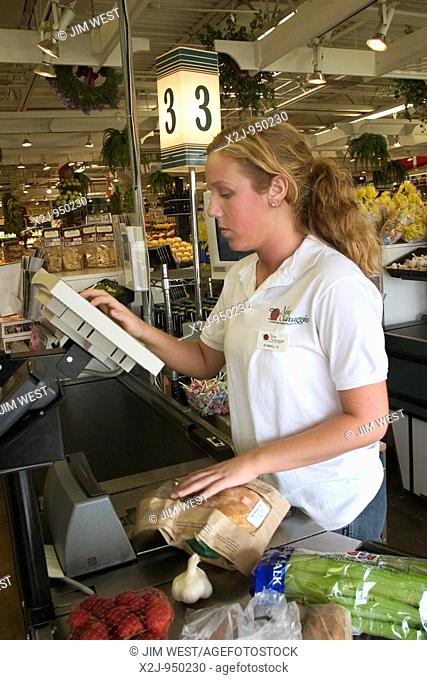 St  Clair Shores, Michigan - Emily Murray, 17, works as a cashier at the Nino Salvaggio International Marketplace