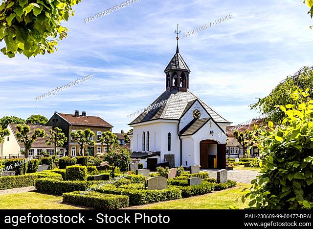 09 June 2023, Schleswig-Holstein, Schleswig: At the center of the Schleswig fishing settlement Holm is a cemetery with a chapel from 1876