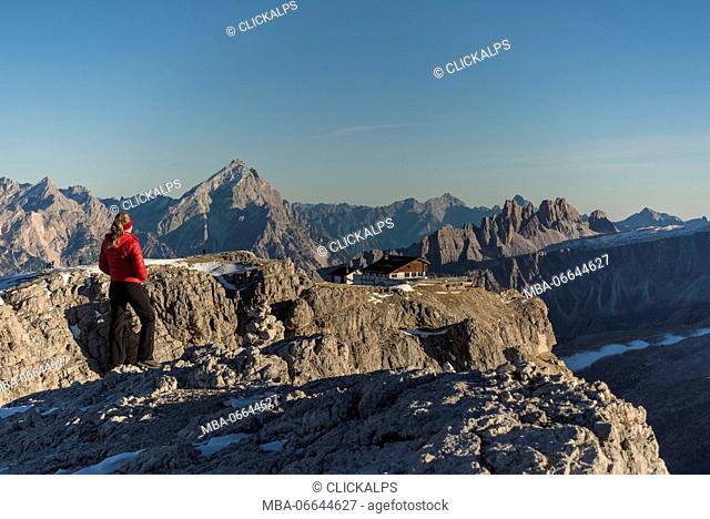 Lagazuoi mount, Falzarego Pass, Dolomiti, Dolomites, Belluno, Veneto, Italy. hiker look at Lagazuoi refuge