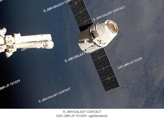 The SpaceX Dragon commercial cargo craft is about to be grappled by the Canadarm2 robotic arm at the International Space Station
