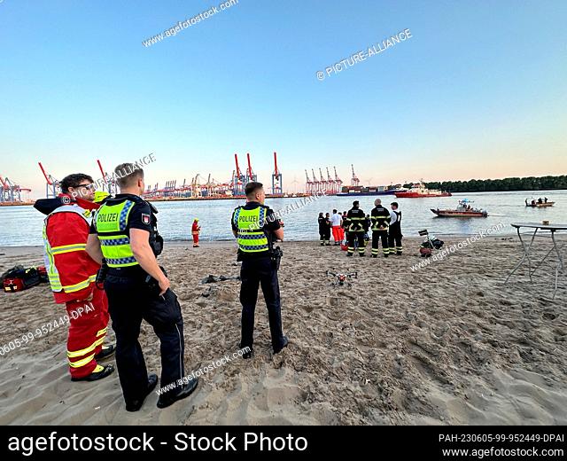 05 June 2023, Hamburg: Rescue workers and police are in action on Hamburg's Elbe beach. Police and firefighters searched for a man in the Elbe River in Hamburg...