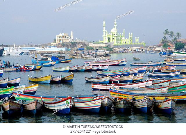 Fishing boats with Vizhinjam mosque in the background, Kerala, South India