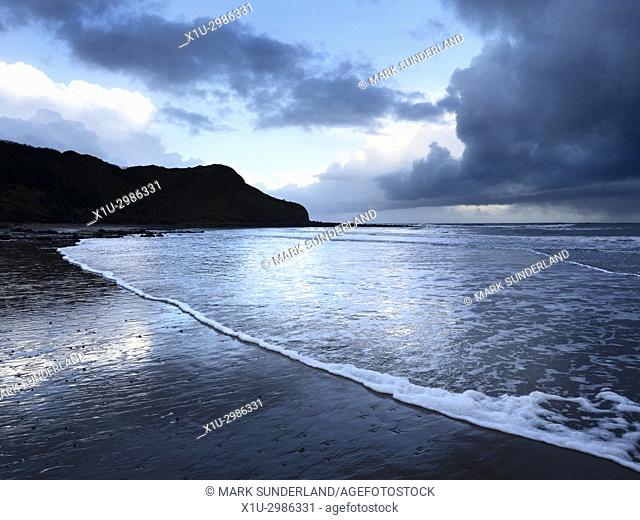 Osgodby Point or Knipe Point and Ebbing Tide at Dusk Cayton Bay Scarborough North Yorkshire England