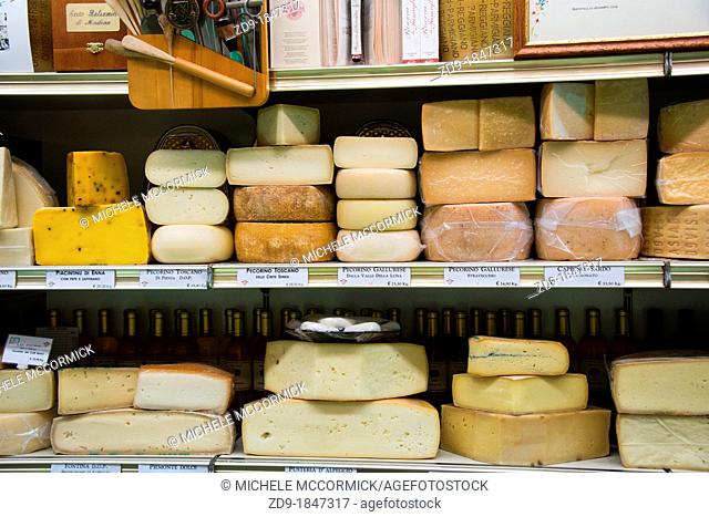 Rounds of cheese line shop shelves in Marostica, Italy