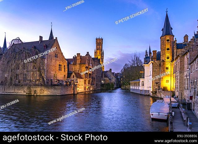 Rozenhoedkaai canal with belfry at dusk, Bruges, Belgium