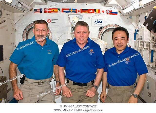NASA astronauts Dan Burbank (left), Expedition 30 commander; and Mike Fossum (center), Expedition 29 commander; along with Japan Aerospace Exploration Agency...