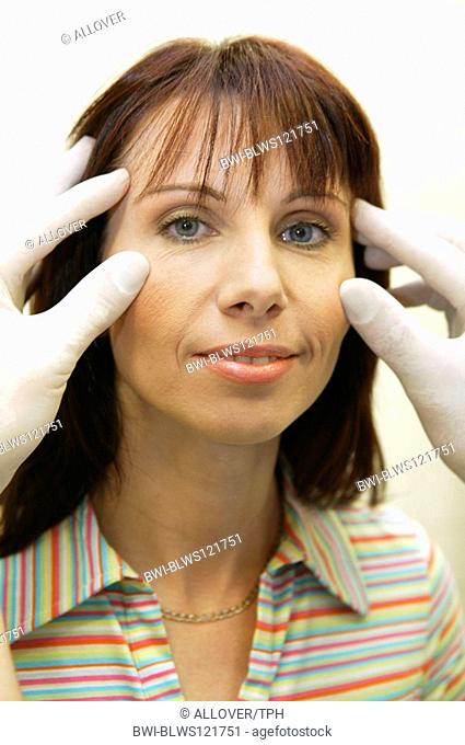 woman at plastic surgeon, facelift