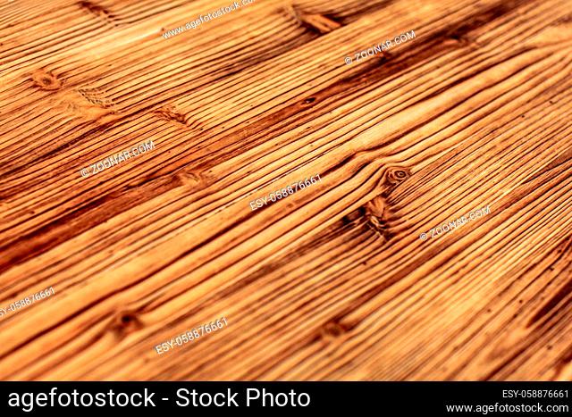 Detail on wooden boards, grain of wood enhanced by burning