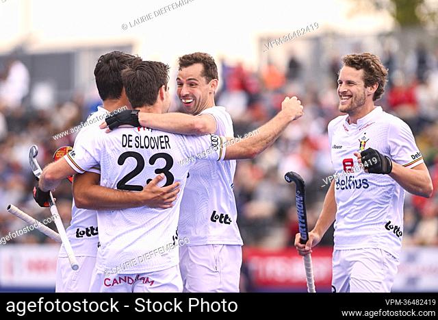Belgium's Arthur de Sloover and Belgium's Florent van Aubel celebrate after scoring during a hockey match between England and the Belgian Red Lions in the group...